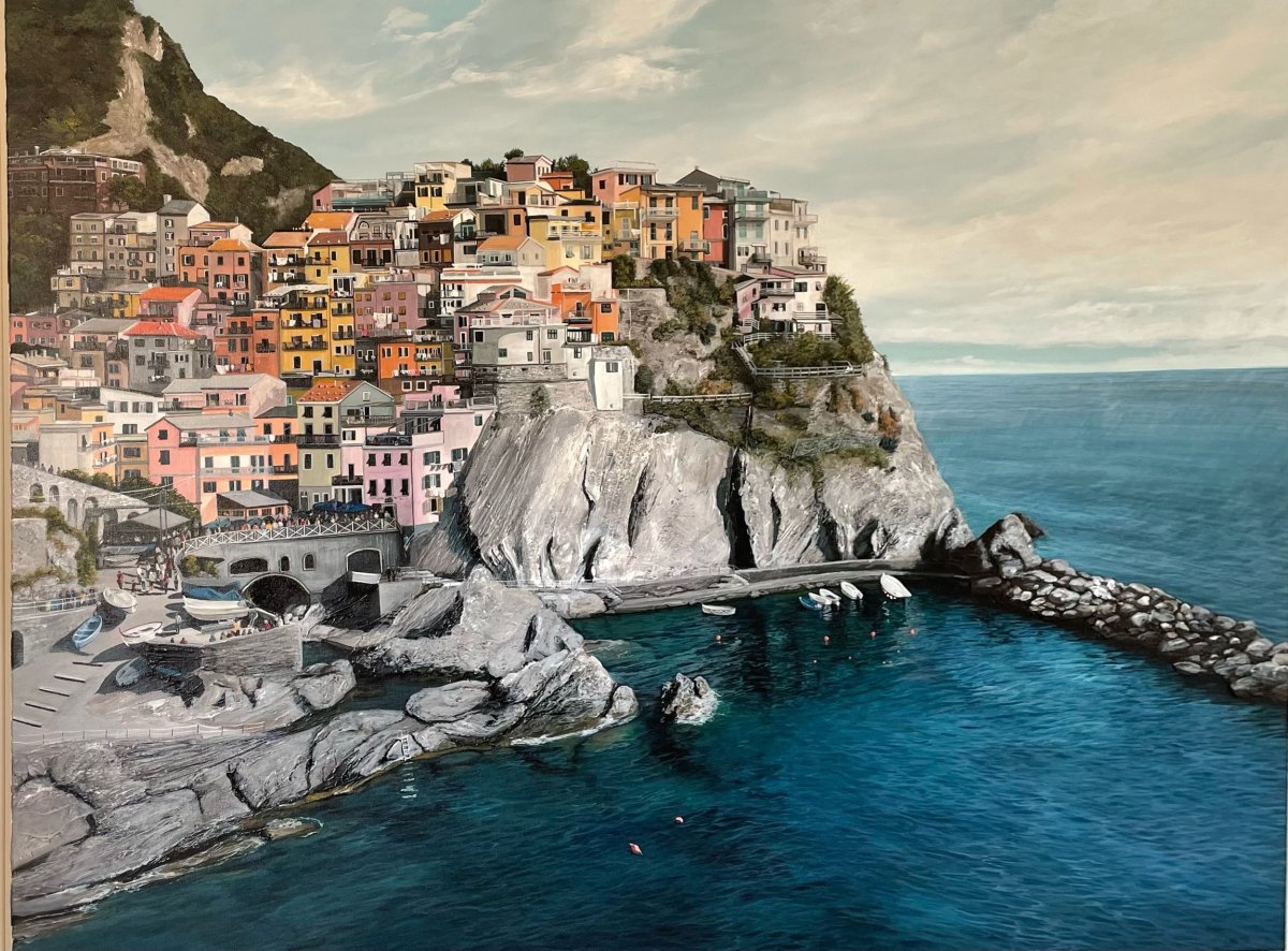 A large fine art painting of Manarola, Vernazza. Colourful houses built on cliffs overlooking the sea, with boats docked in a small harbour and a rocky shoreline in a coastal village, by fine artist Andreea Ionela Berindei